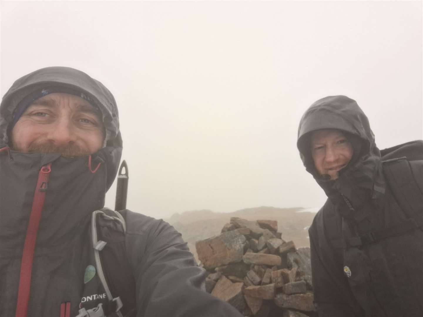 No views but smiles at Lurg Mhor’s summit cairn.
