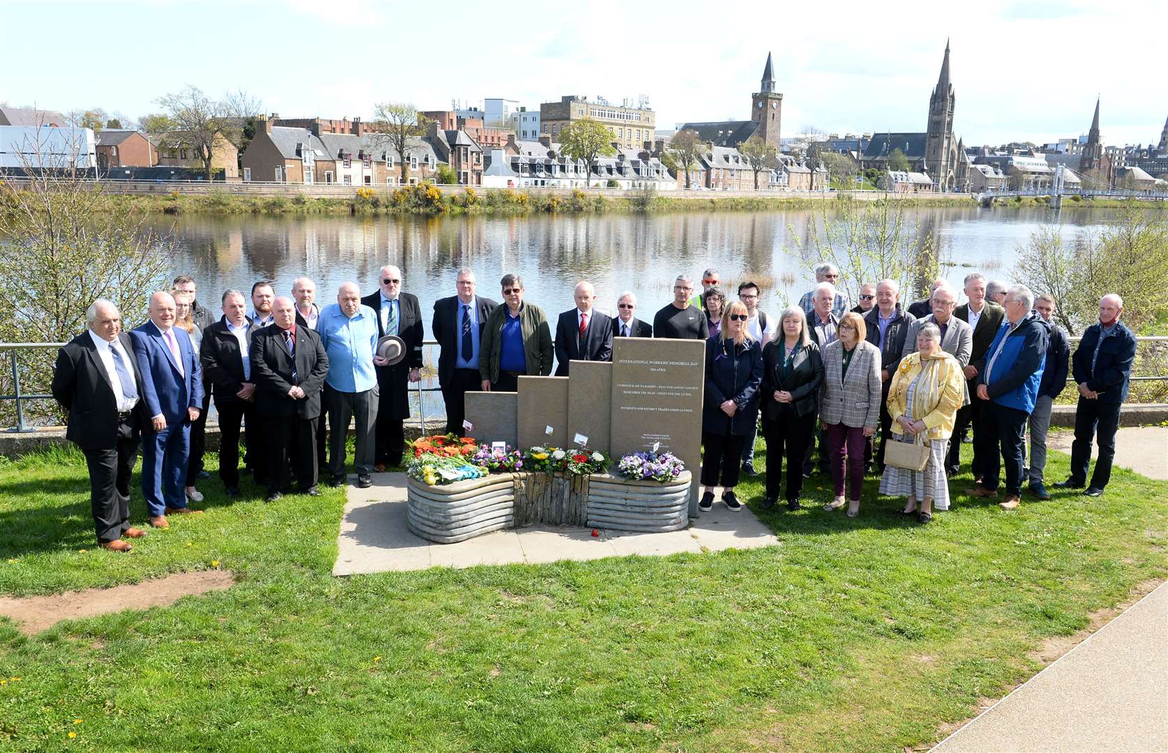 Trade union representatives, workers, families and politicians gathered at the memorial by the River Ness in 2022 to mark International Workers' Memorial Day.