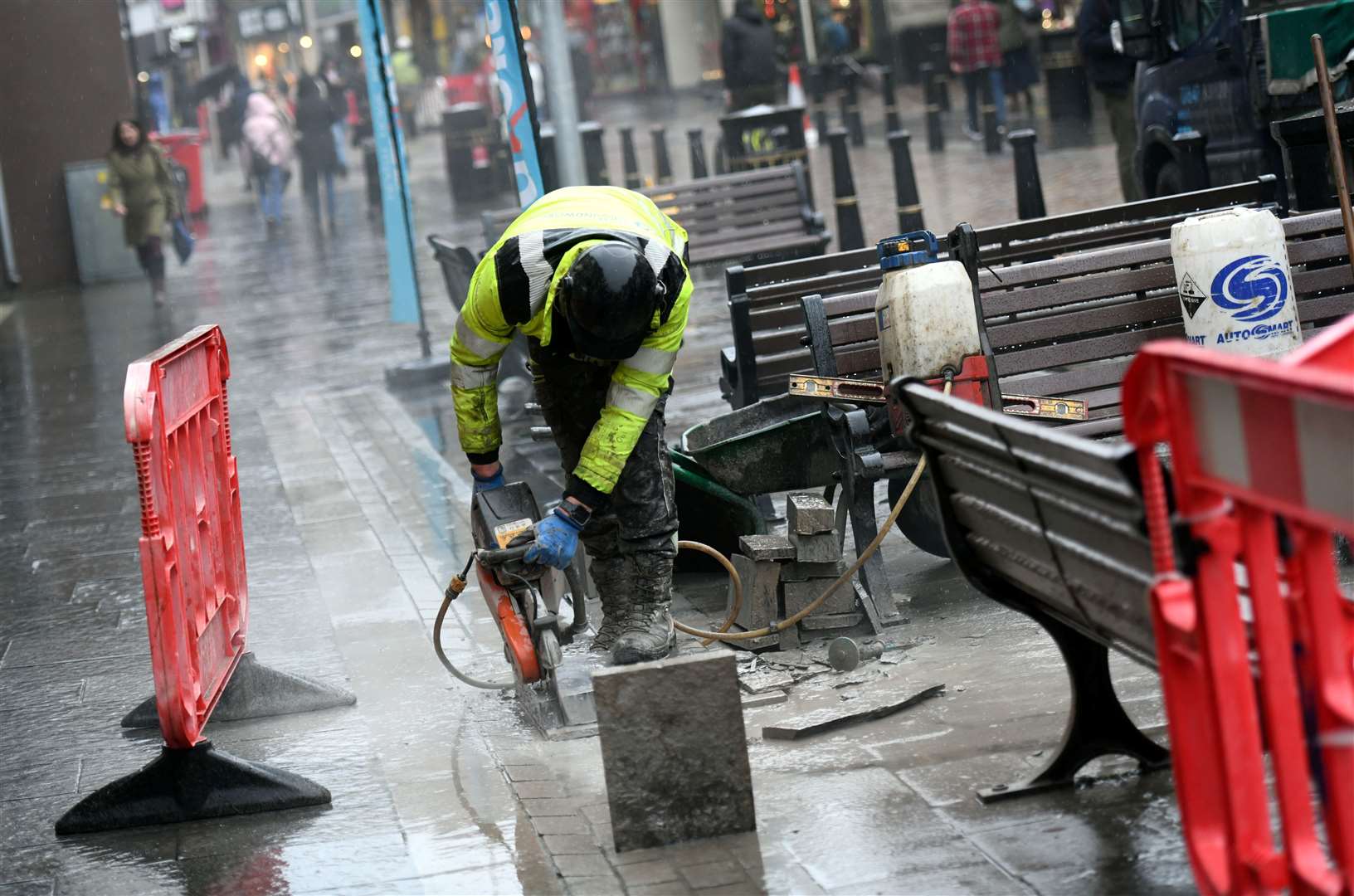 A foundation goes in for a High Street light post.