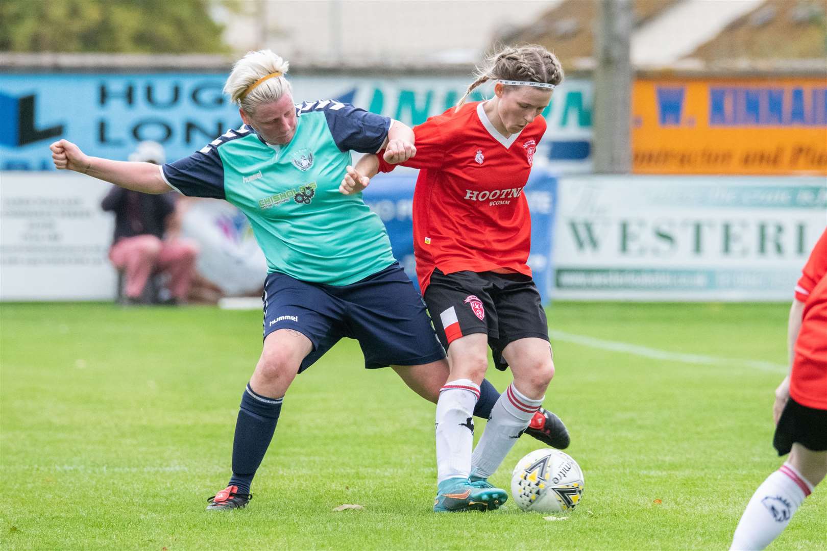 Buckie's Alicia Paterson tries to win the ball away from Caithness' Carly Erridge. ..Buckie Ladies (3) vs Caithness Ladies (1) - SWF Highlands & Islands League Cup Final 2023 - Station Park, Nairn 24/09/2023...Picture: Daniel Forsyth..