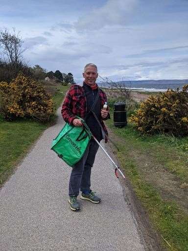 Neil Mapes of Green Hive on a litter pick at the seafront