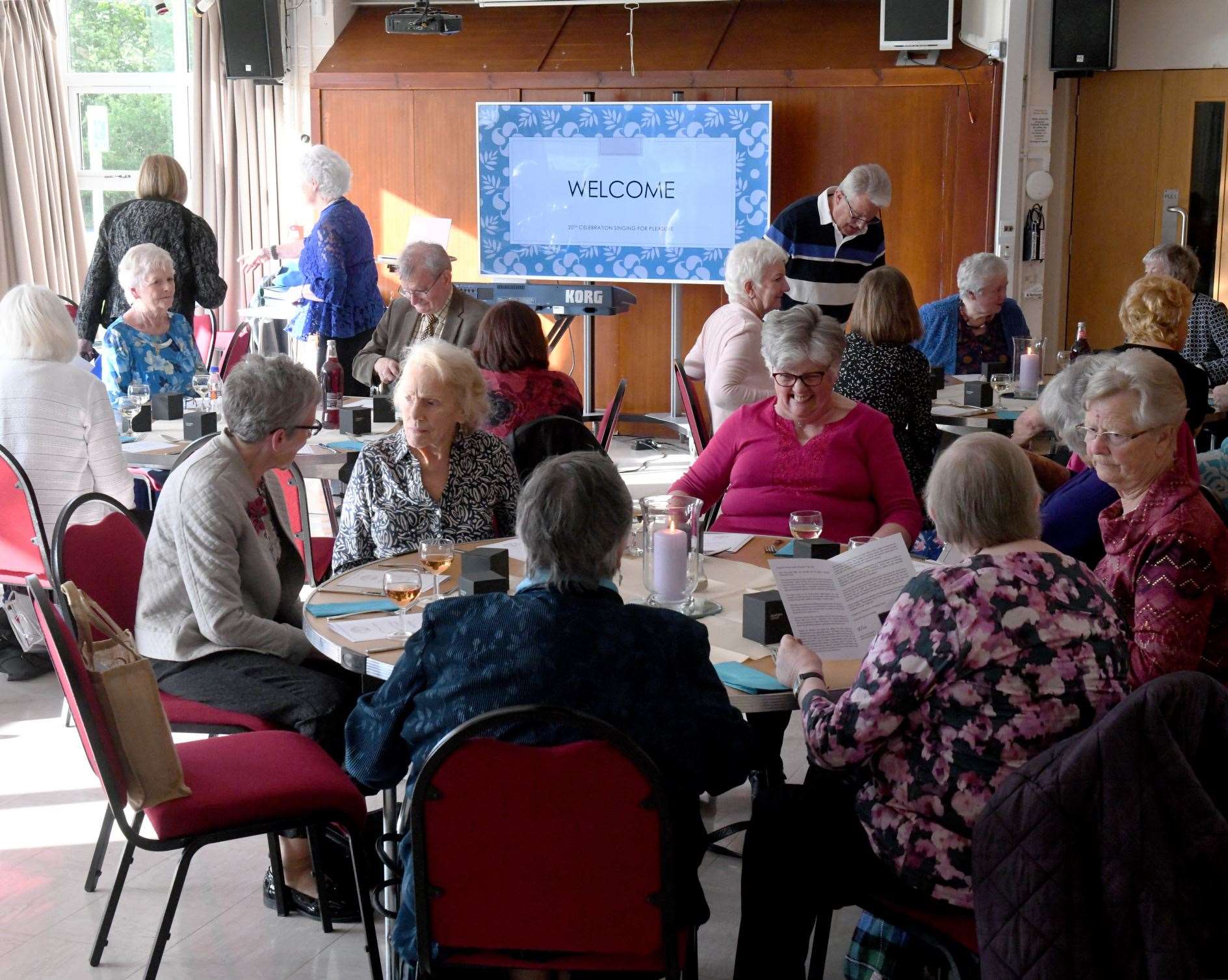 Singing For Pleasure members reminisce over dinner at Merkinch Community Centre.