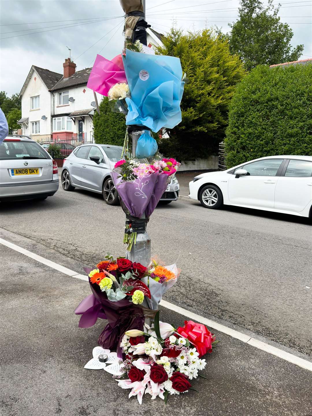 Flowers and tributes left for the two teenagers in Ely, Cardiff, whose death in a car crash sparked a riot (PA)