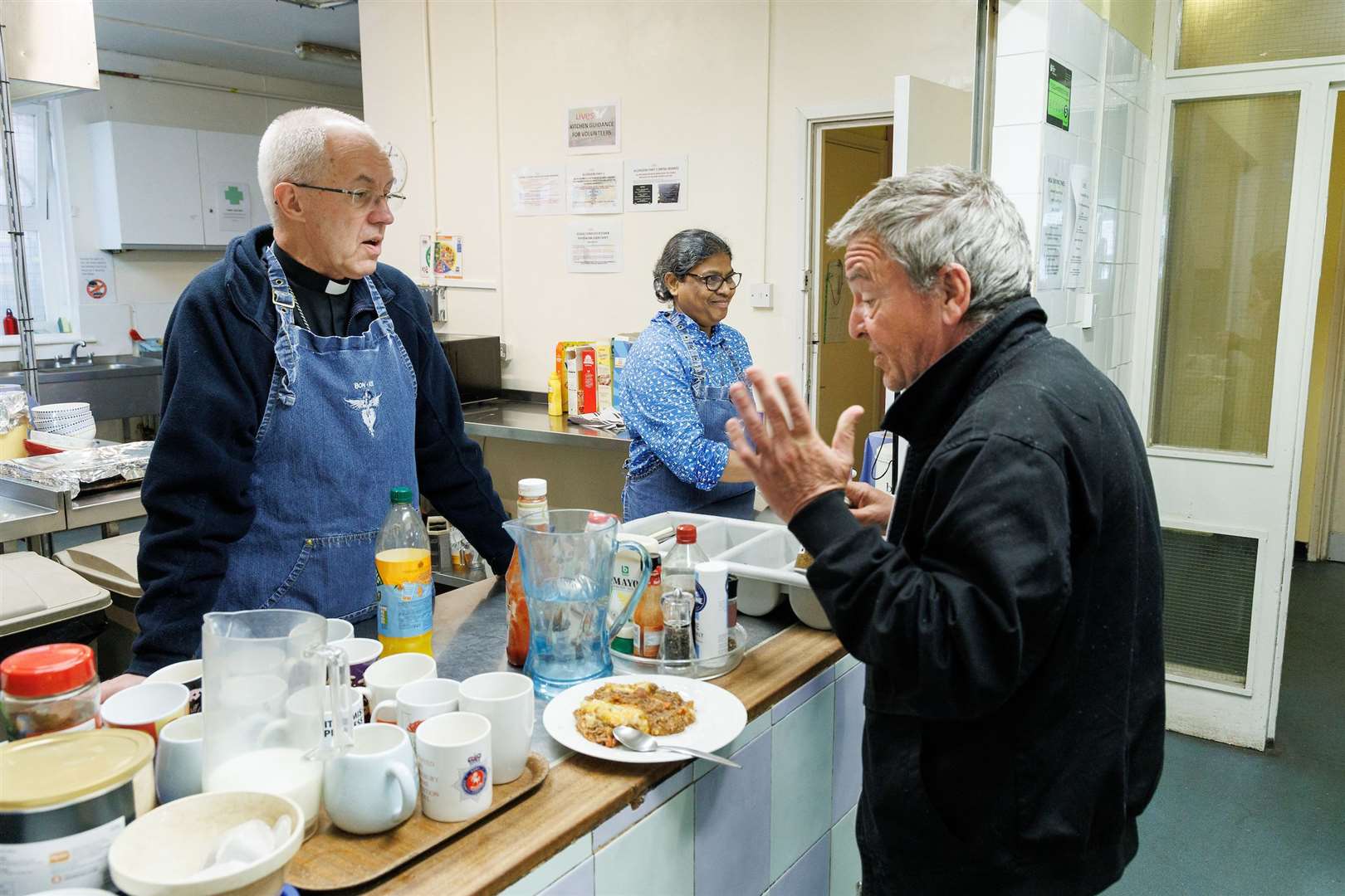The Archbishop of Canterbury Justin Welby volunteered by serving lunch during a visit to the Catching Lives Open Centre in Canterbury (Neil Turner/Lambeth Palace/PA)