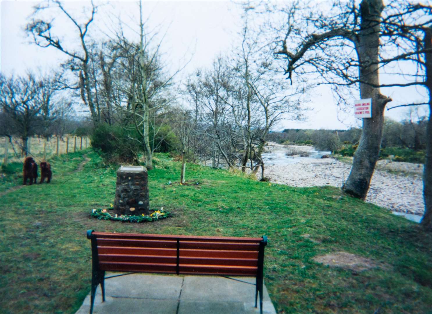 Land between the river and memorial cairn has been eroded over time.