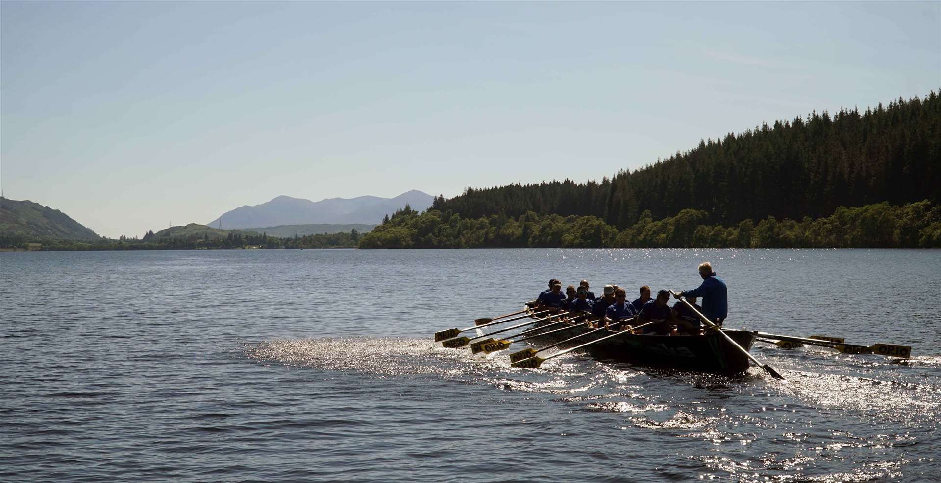 Jock Wishart’s Trainera boat rowing Loch Ness.
