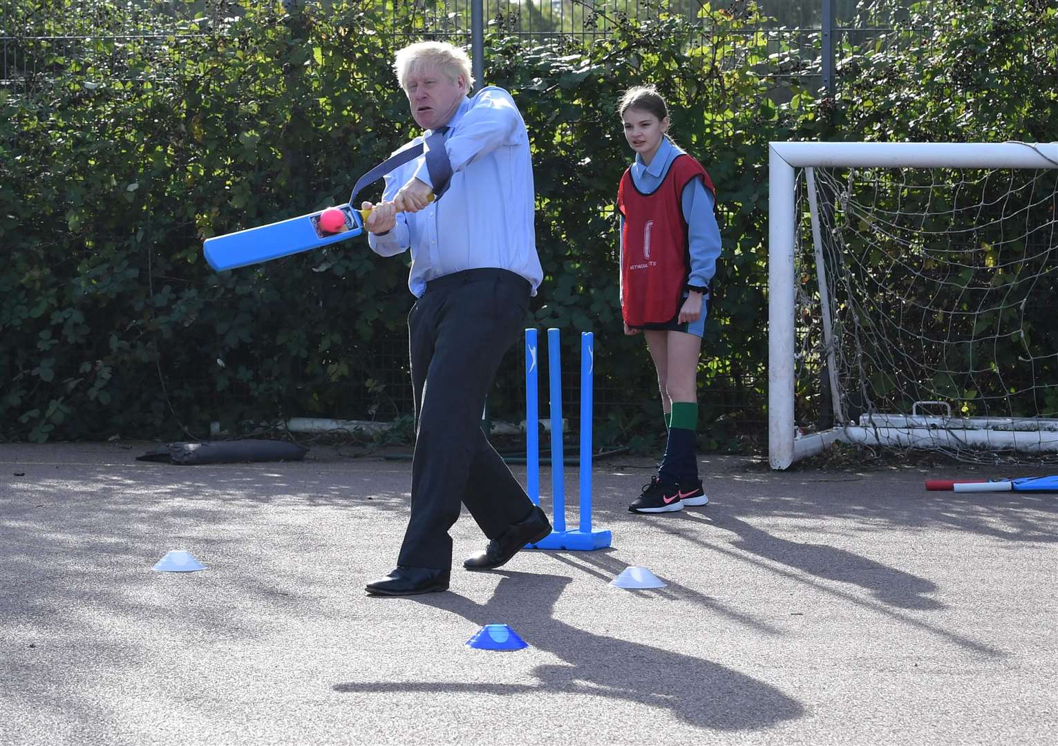 Prime Minister Boris Johnson takes part in a game of cricket during a sports lesson at Ruislip High School in his local constituency of Uxbridge (Stefan Rousseau/PA)