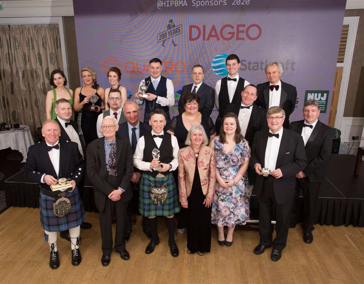 The winners of the press awards including Val Sweeney (front, centre), Louise Glen (directly behind her), Callum Mackay (directly behind Louise) and Eric Cormack (front, left).