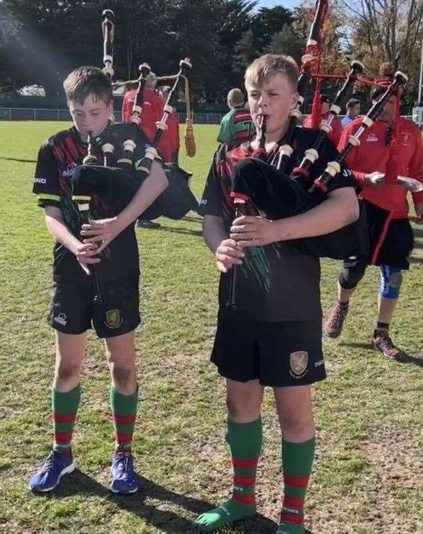 Two under 14's piping.
