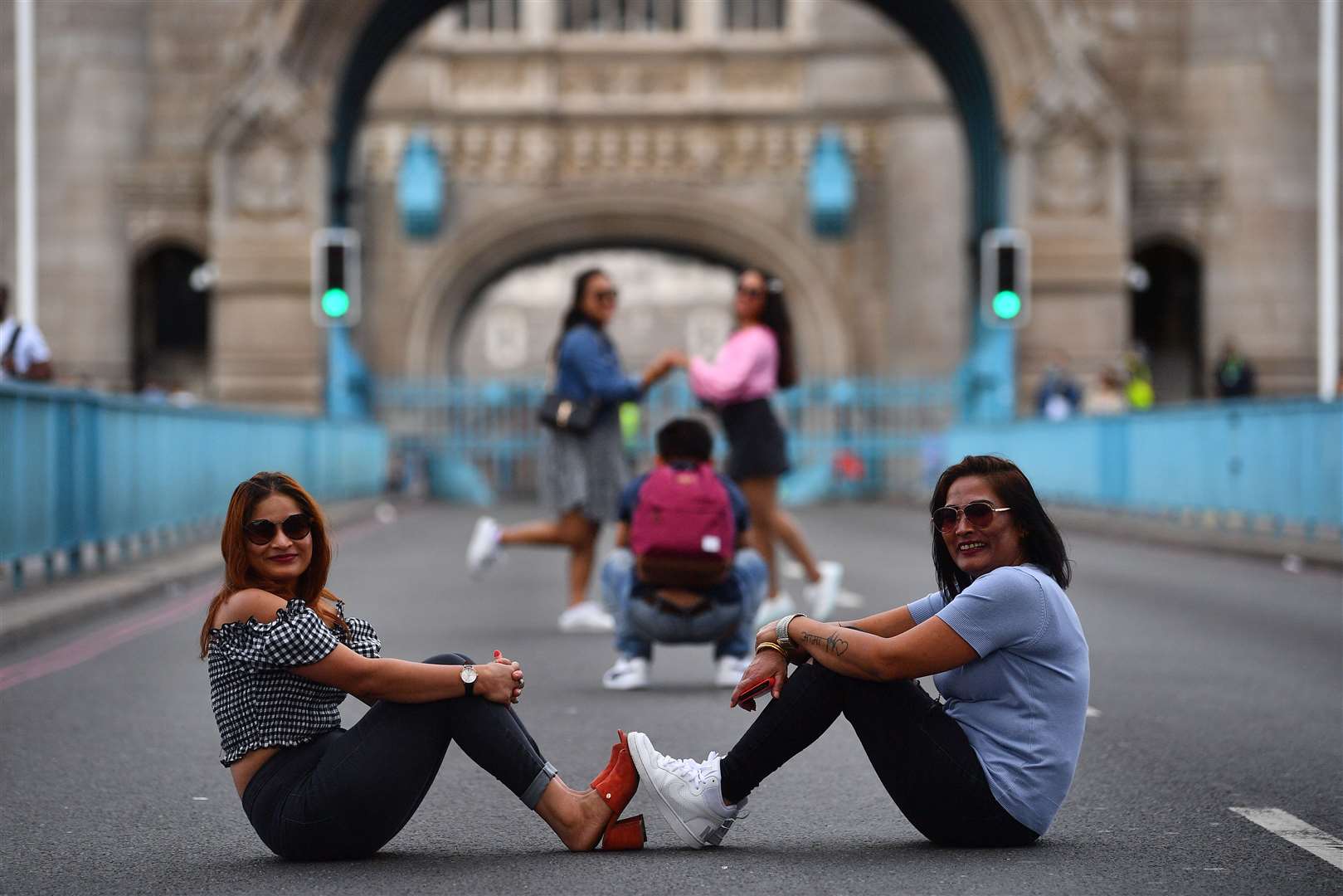 Tourists pose for pictures on Tower Bridge (Victoria Jones/PA)