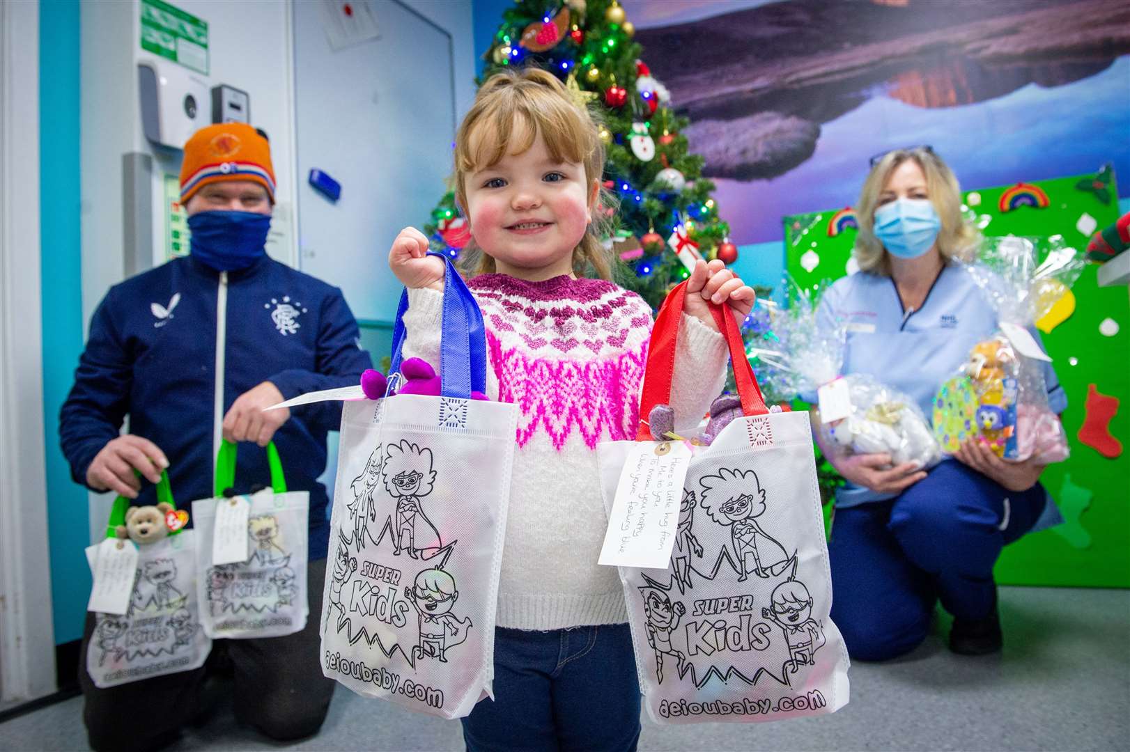 Martin MacDougall and Maisie Star Torley with donations for Stephanie MacKenzie at the Highland Children's Ward. Picture: Callum Mackay