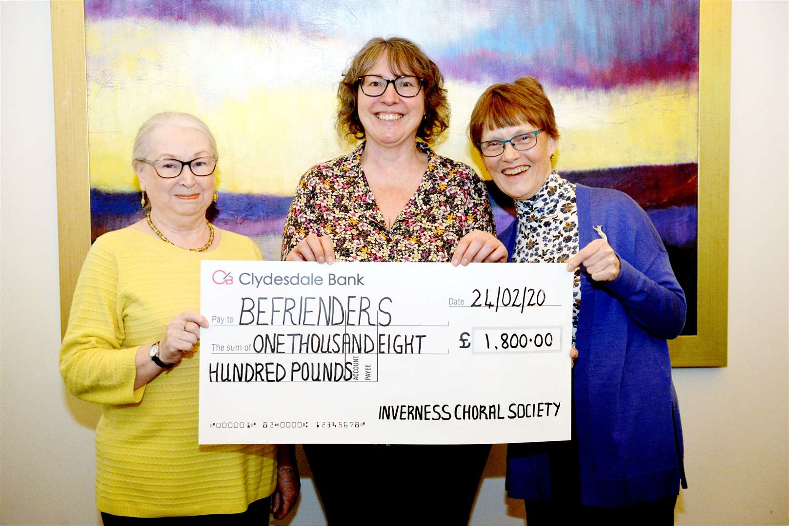 Kate Currie and Carol Brown presenting the cheque to befriending co-ordinator Susan White.