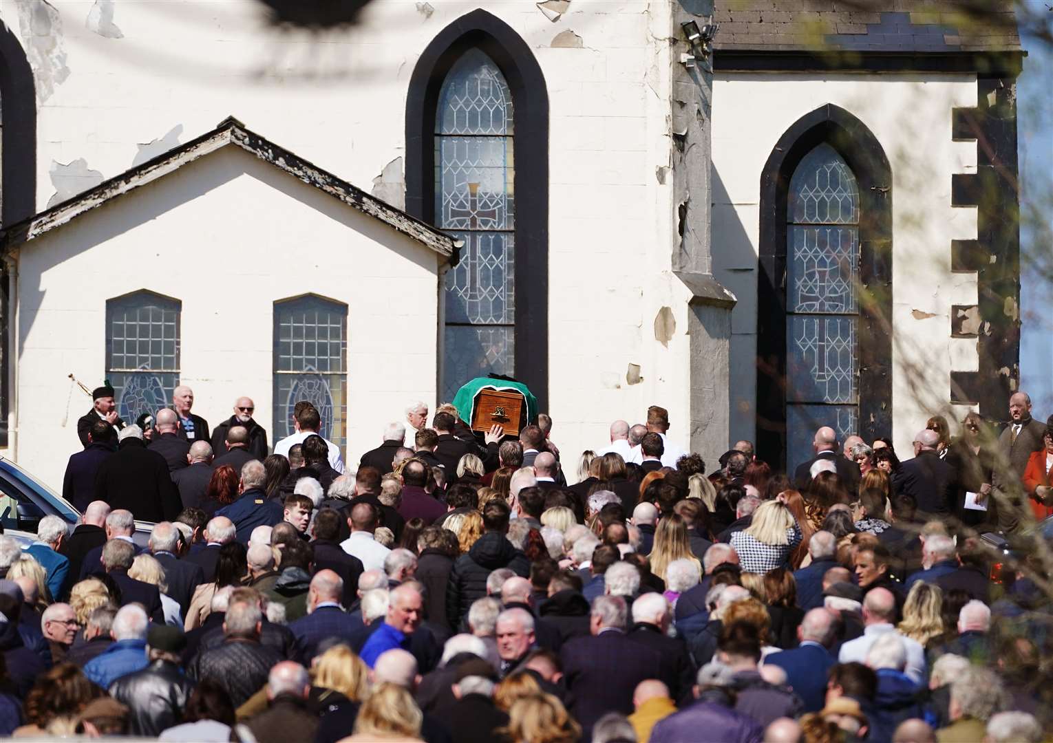 The coffin of Colm Murphy, who was found liable in a civil case for the 1998 Omagh bombing, is carried to the Church of St Laurence O’Toole, Belleeks, Co Armagh (Brian Lawless/PA)