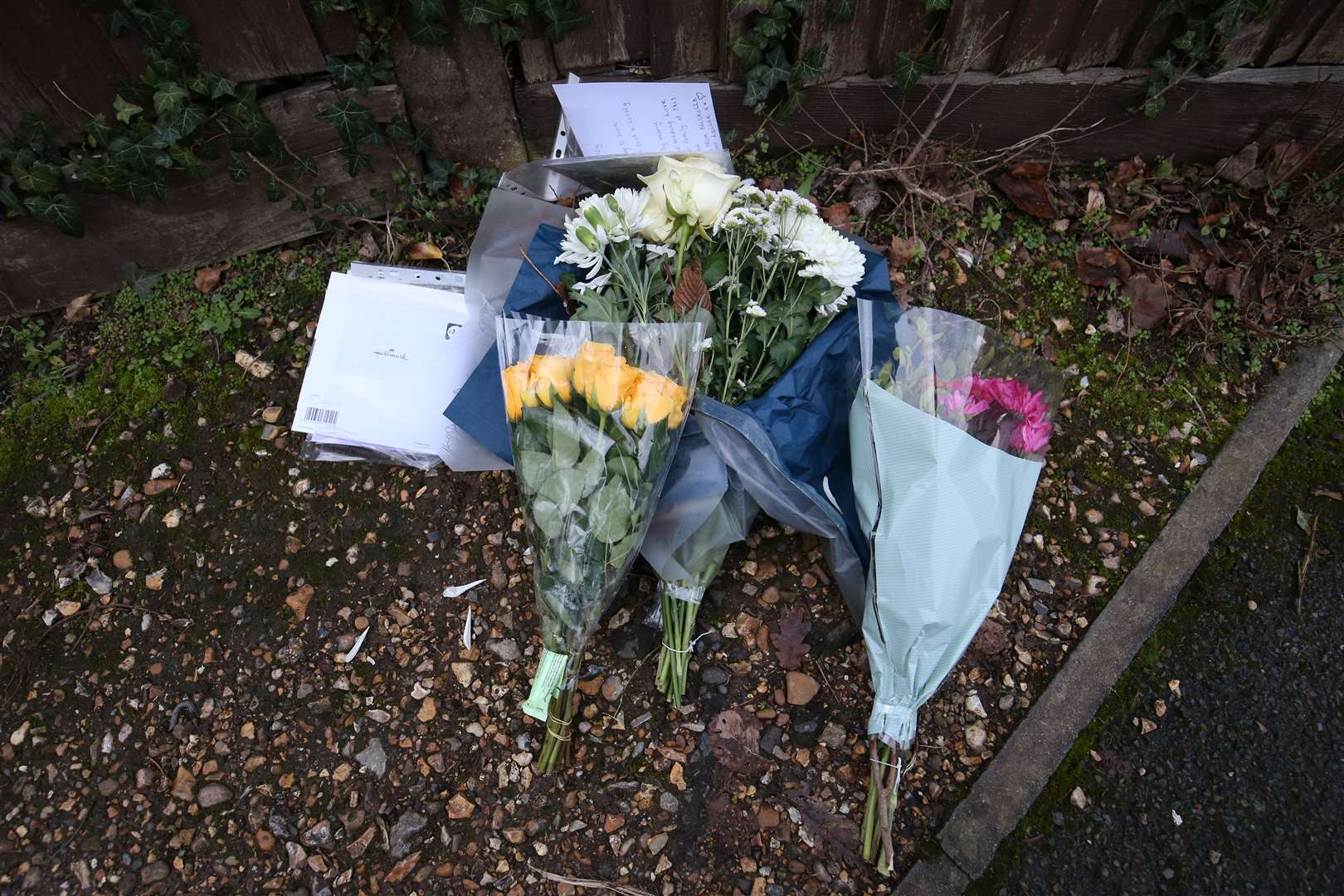 Floral tributes and cards left outside Highdown School in Reading following Olly Stephens’s death (Jonathan Brady/PA)