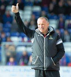 John Hughes salutes the home support during Saturday's 1-0 win over Dundee United
