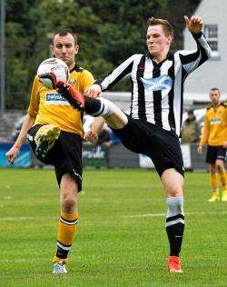 Fort William's John McLeod and Wick's Steven Anderson tussle for the ball.