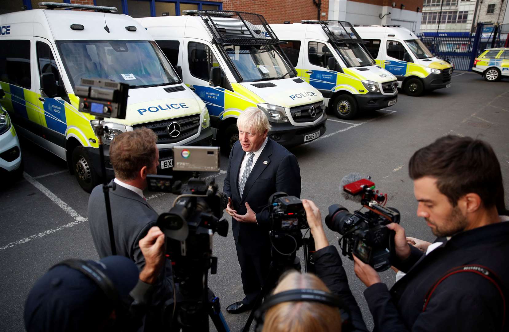 Boris Johnson speaks to the media at a police station in south-east London (Peter Nicholls/PA)