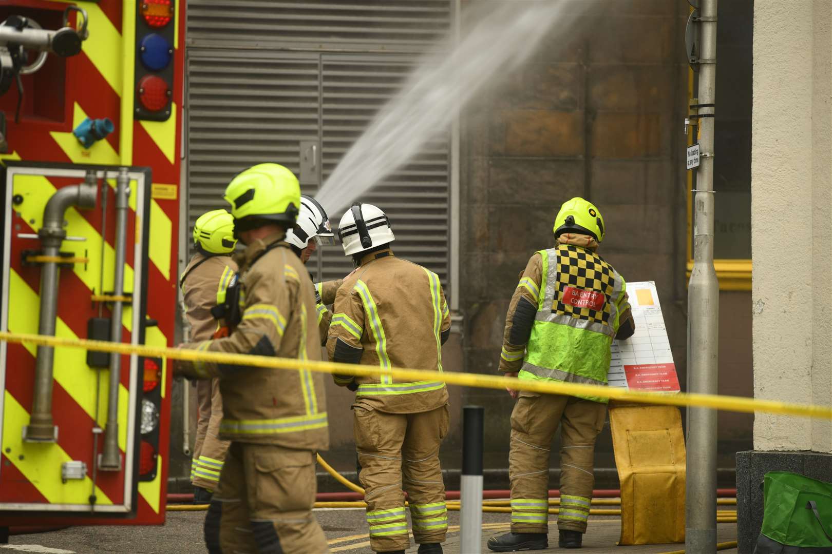 The Fire Rescue Service using a hose. Picture: James Mackenzie.