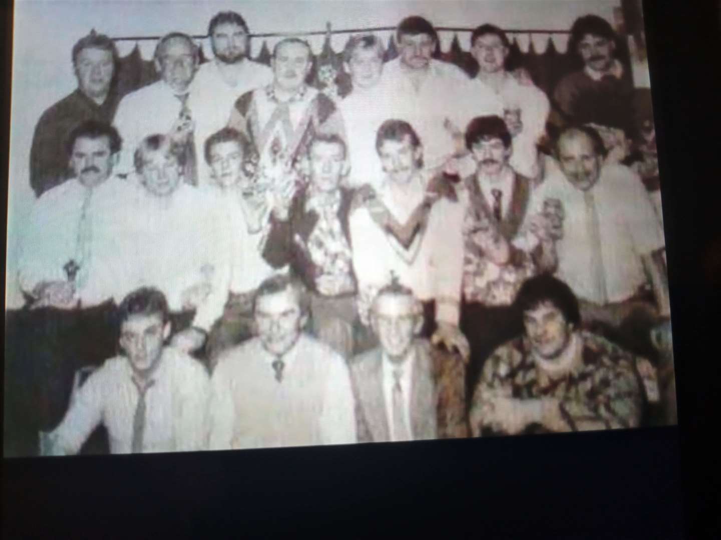 Billy Corbett, far left in the middle row, during an Inverness District Council Works’ staff night out in the 1980s.
