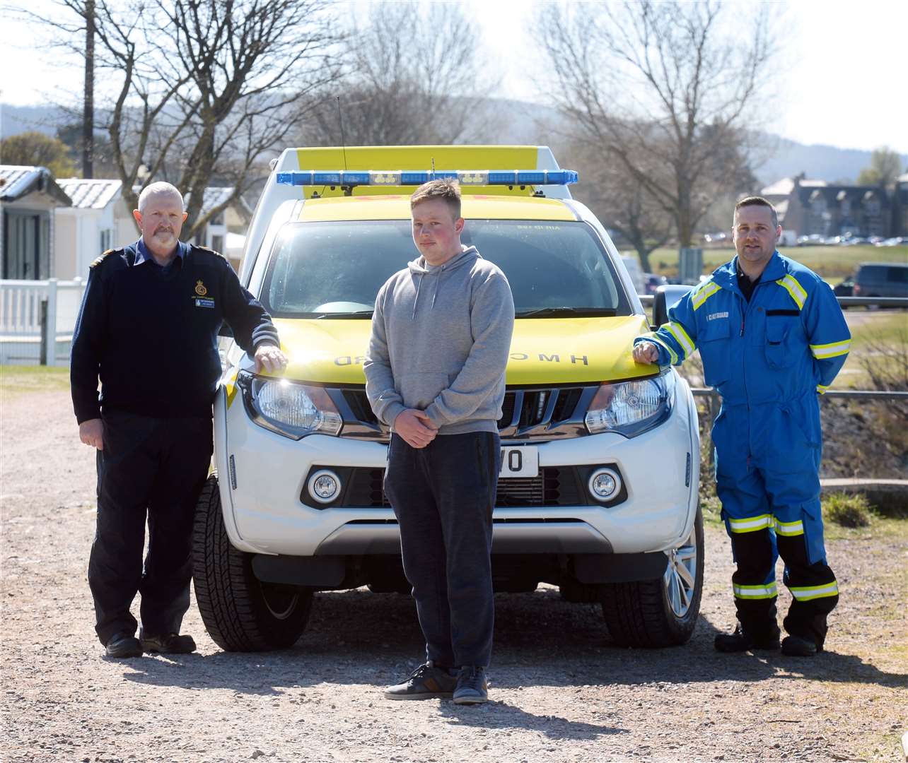 Rescued swimmer Seth King (centre) with Nairn coastguards Tom Rennie (left) and Andrew Czaja. Picture: Gary Anthony