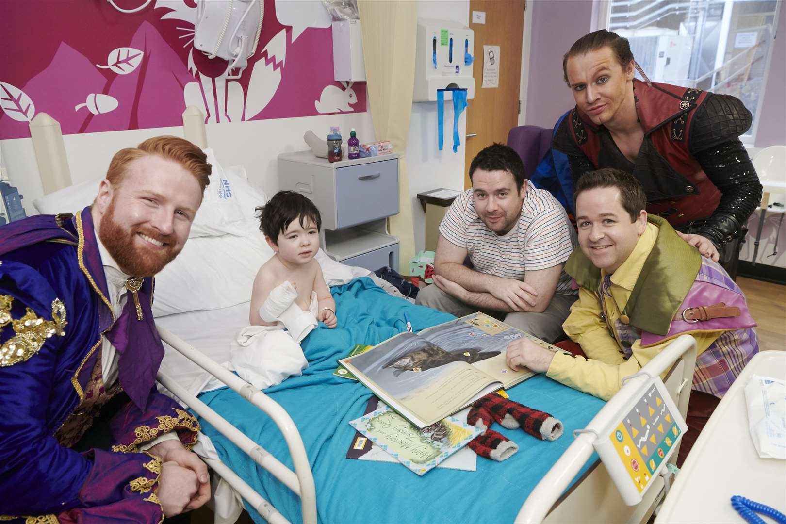 Two year old Louie Thomson, Inverness, and dad Greig meet panto regulars, Steve Wren and Ross Allan.