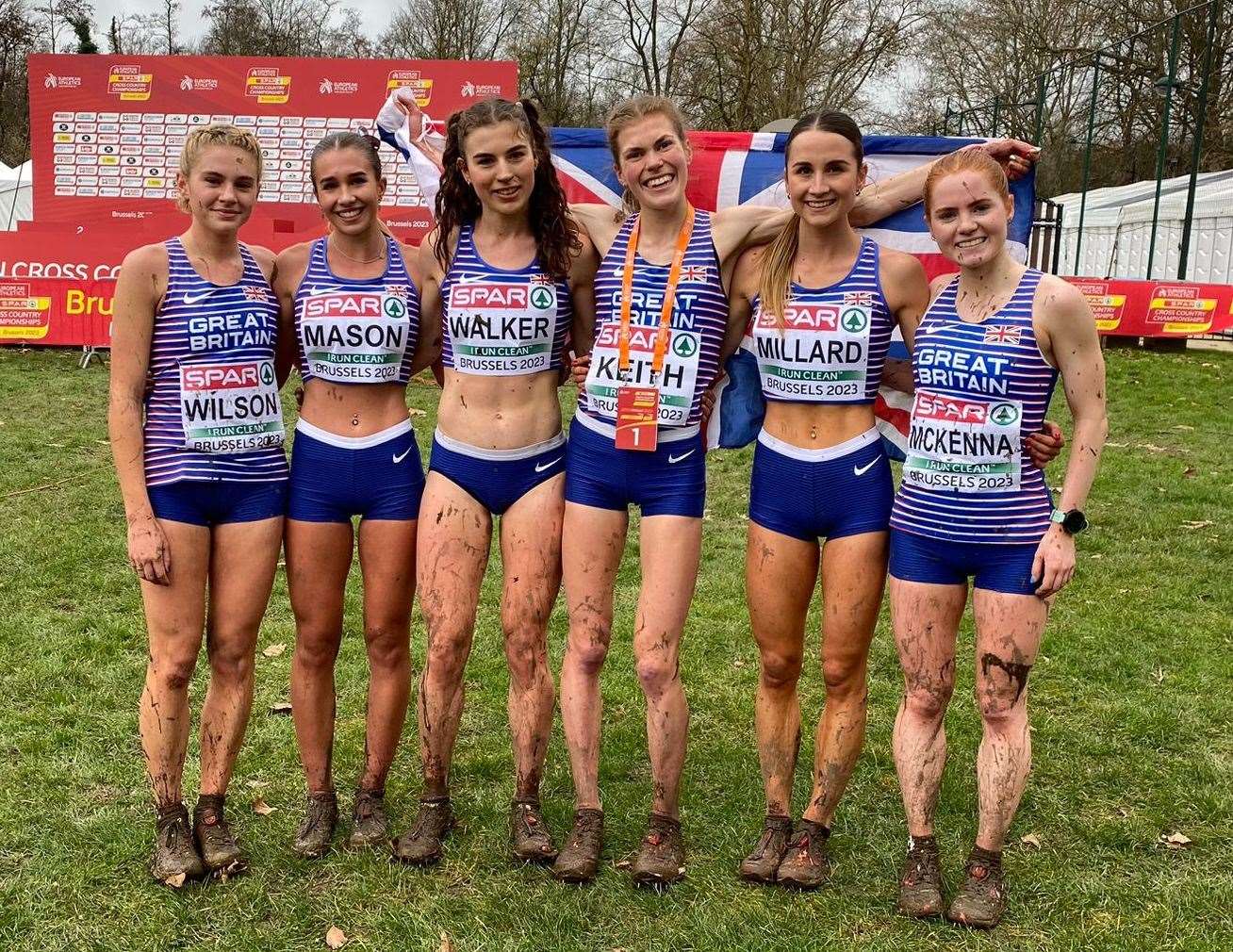 Megan Keith (holding flag) pictured with the Great Britain and Northern Ireland squad at the European Cross Country Championships in Belgium.