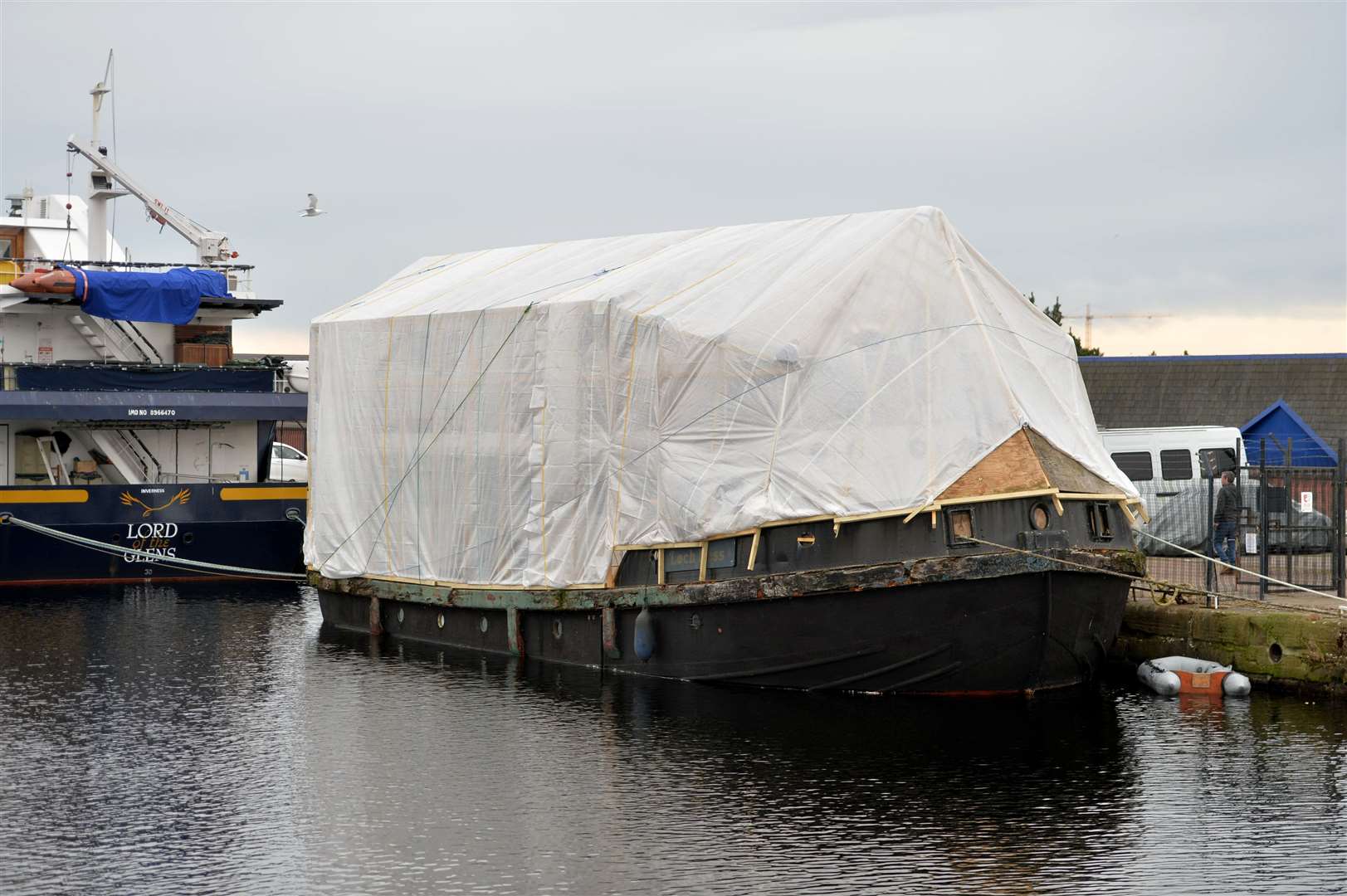 The boat at Muirtown Basin, behind B&M, is becoming more like a house because a wooden extension is being built onto it.