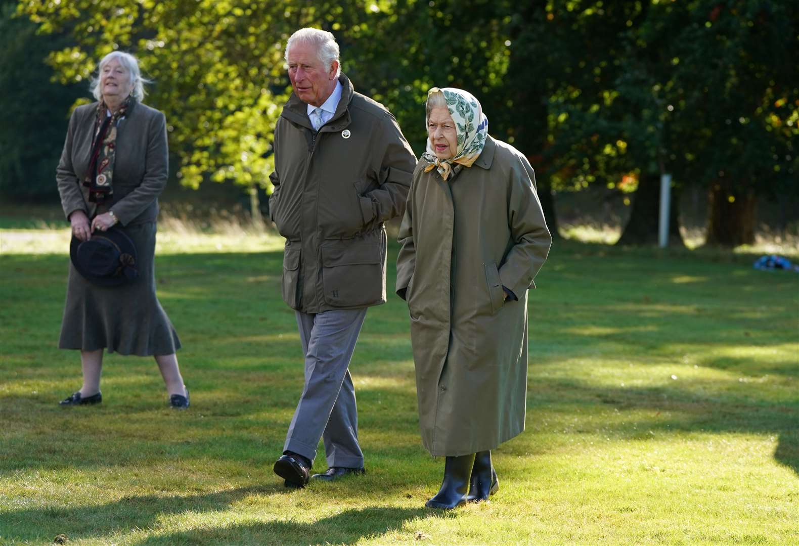 The Queen and the Prince of Wales at Balmoral Cricket Pavilion (Andrew Milligan/PA)