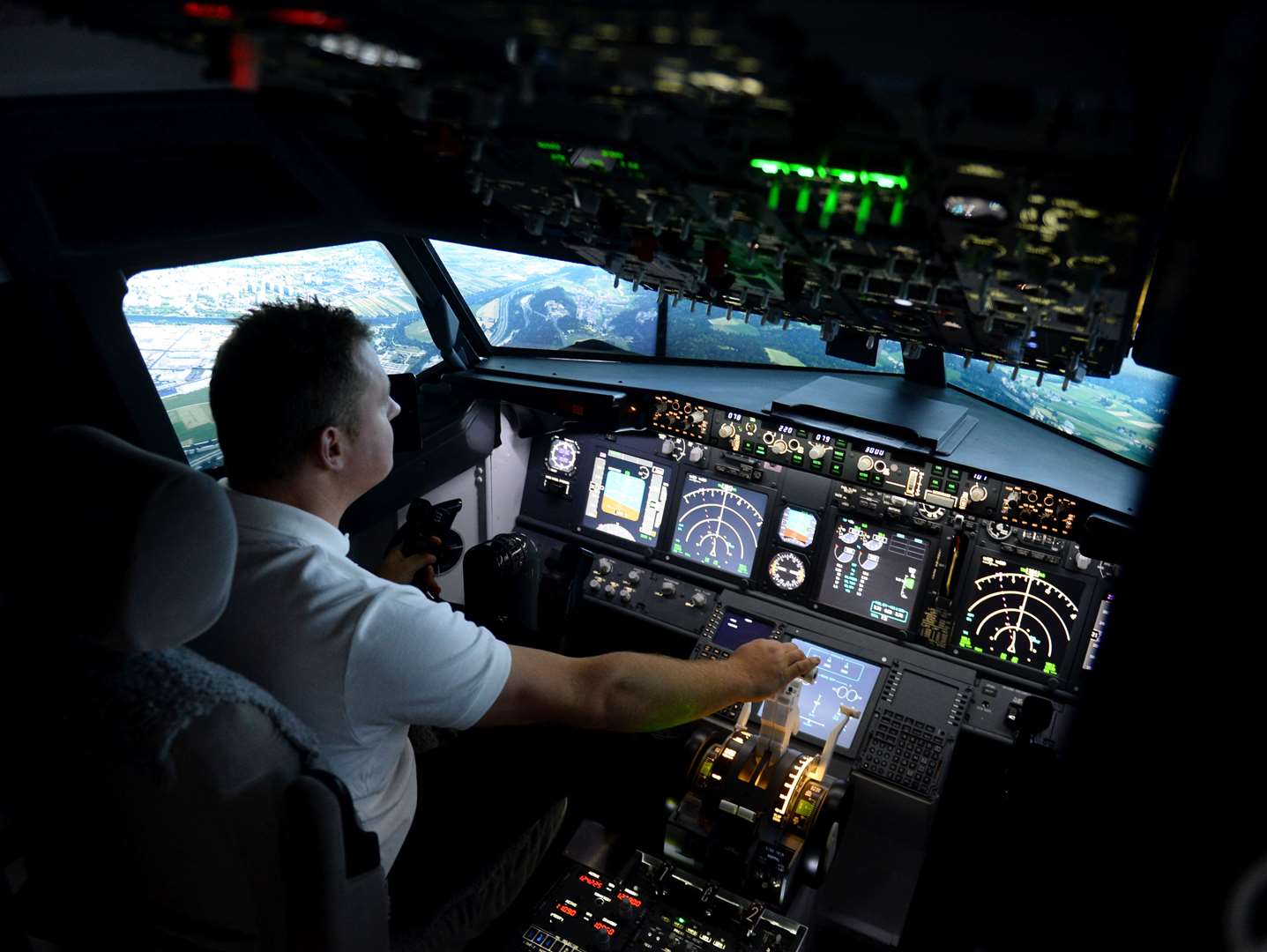 Krystian Rabiej has built a full scale 737 cockpit simulator, pictured flying into Innsbruck. Picture: Gary Anthony