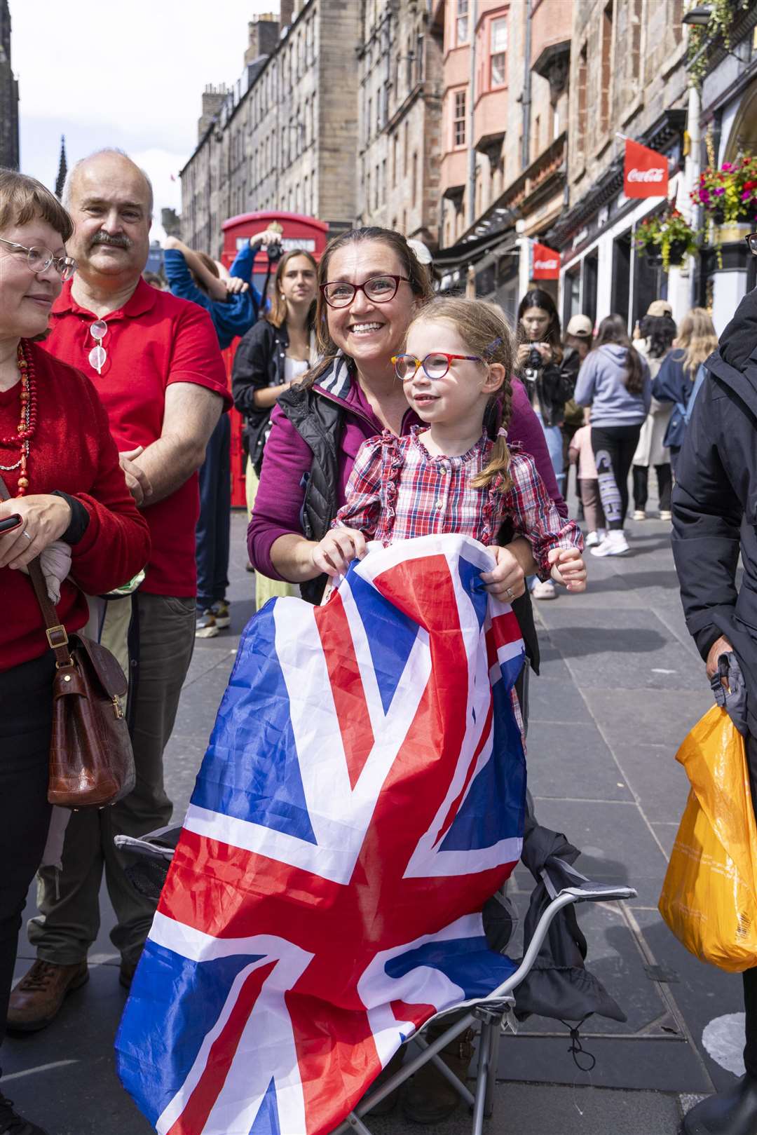 Members of the public on the Royal Mile await the arrival of the royal procession (Jamie Williamson/Daily Mail/PA)