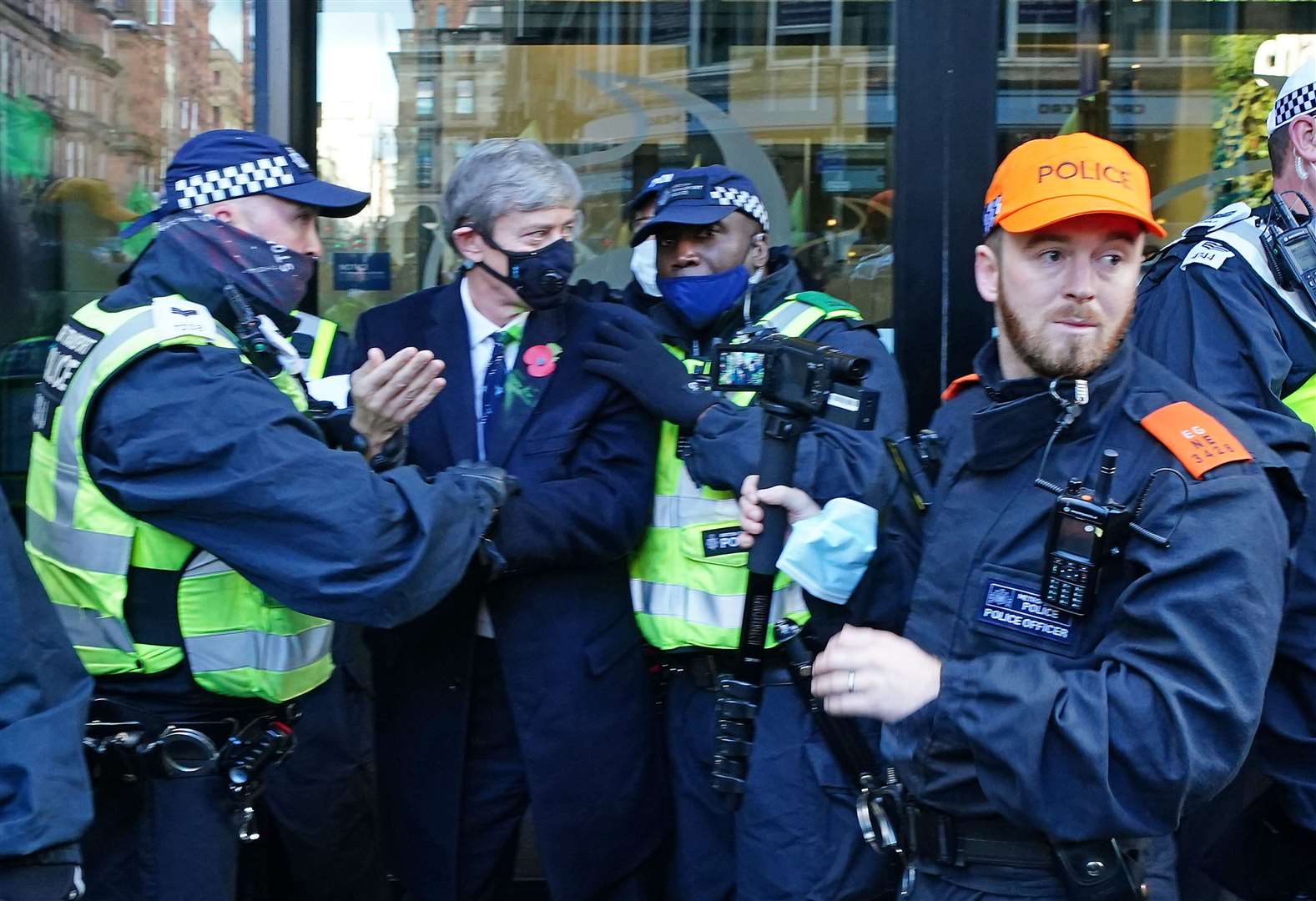 Police hold an Extinction Rebellion protester outside SSE Renewables in Glasgow (Jane Barlow/PA)