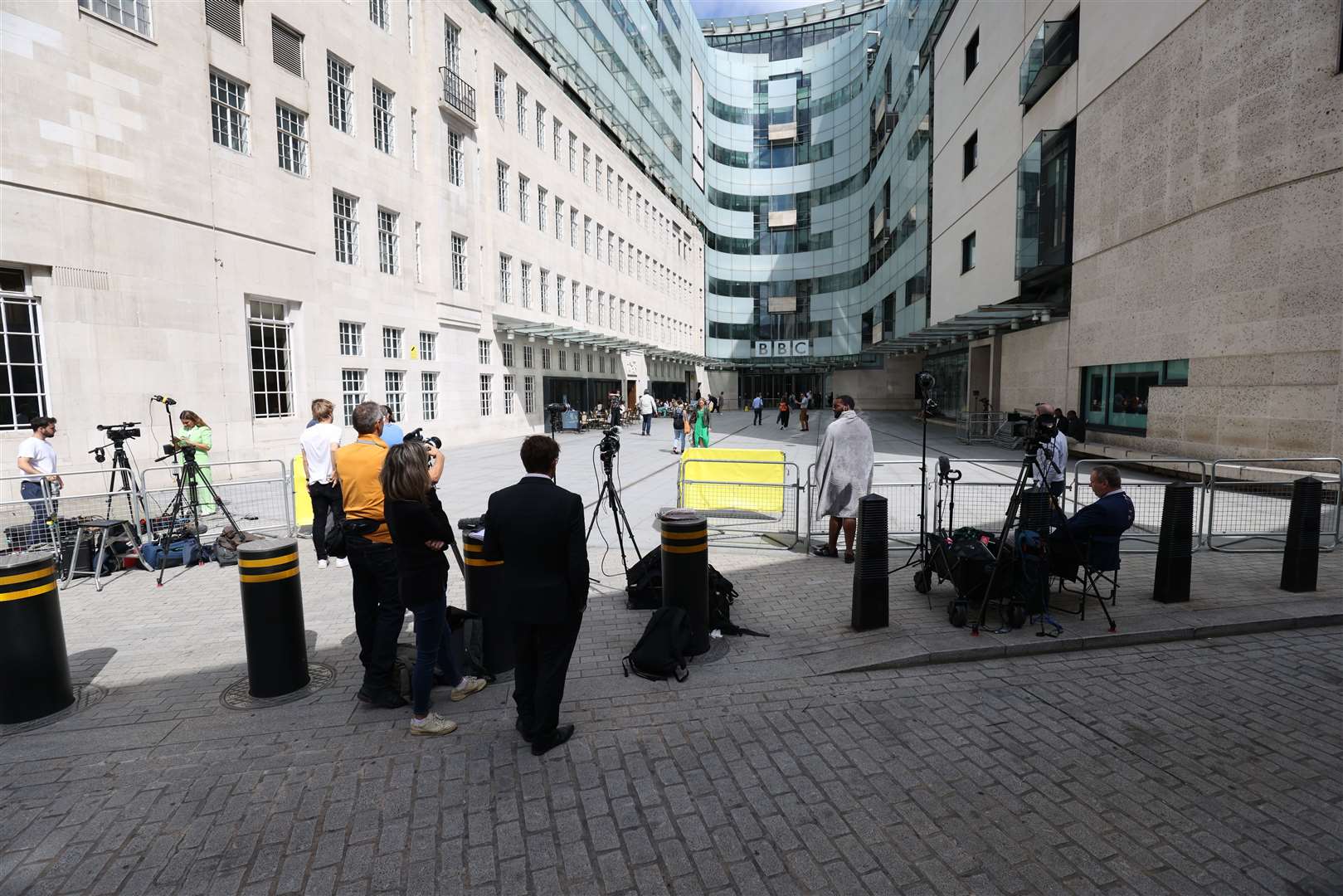 Members of the media gather of BBC Broadcasting House, in central London (Belinda Jiao/PA)