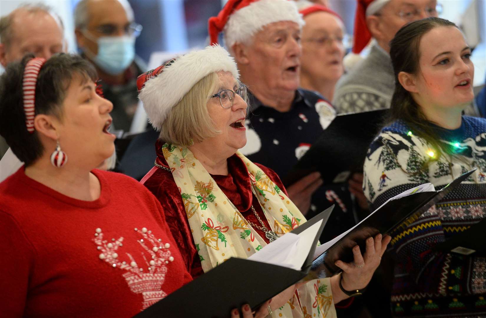 Members of the Acclaim Choir entertain shoppers while raising money for the Haven Appeal.