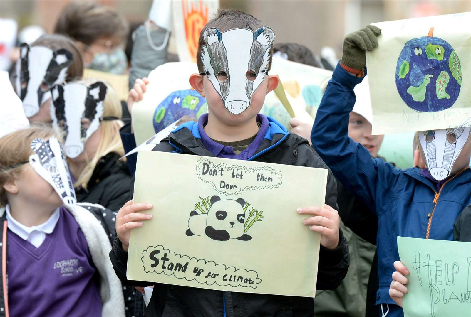 Cura - Guardian. An event to mark the start of the COP 26 at Inverness Cathedral: The school children wore badger masks. Picture: James Mackenzie.