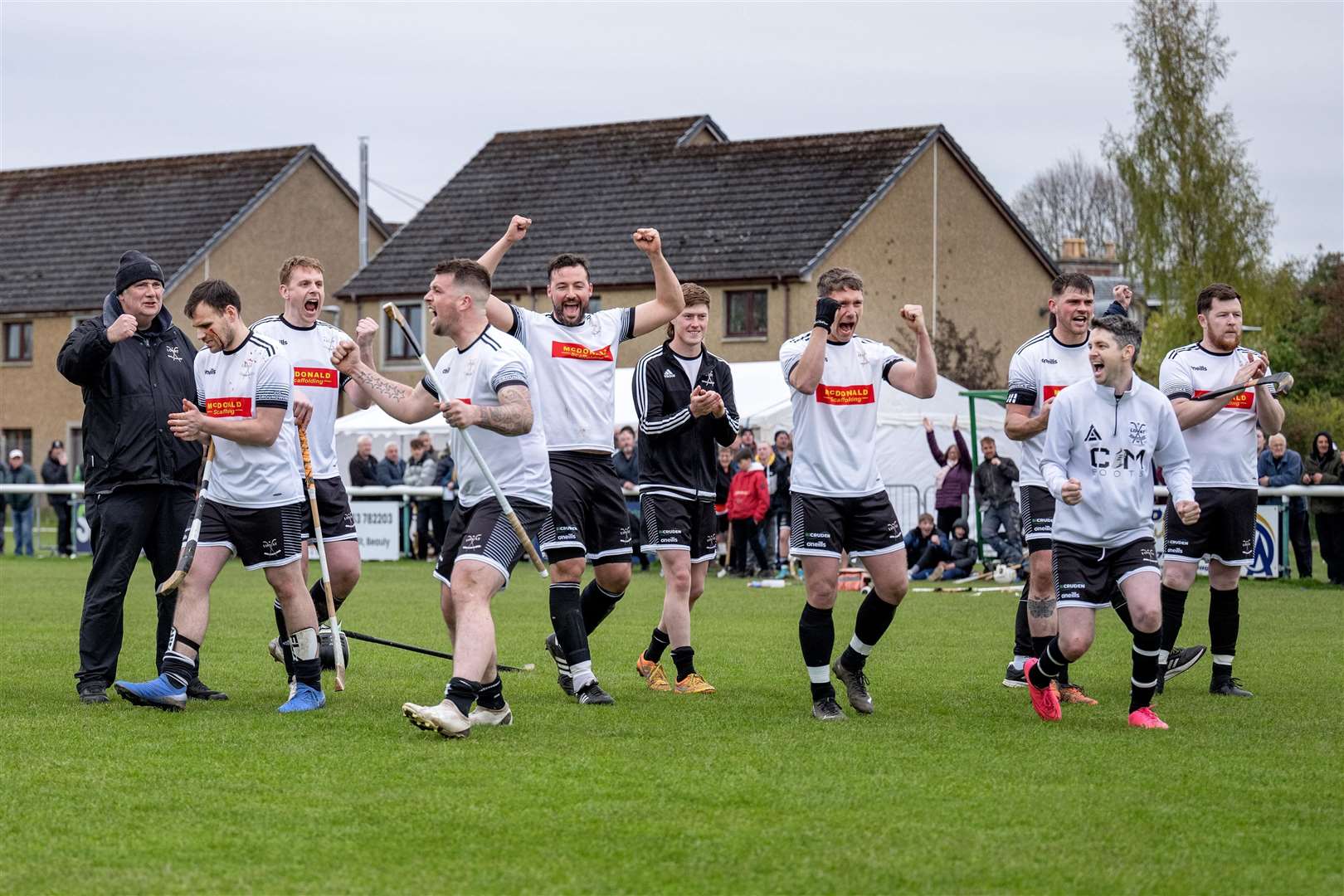 The Lovat team celebrate winning the tie as Craig Mainland scores his penalty. Beauly v Lovat in the Artemis MacAulay Cup 1st Round tie, played at Braeview, Beauly.
