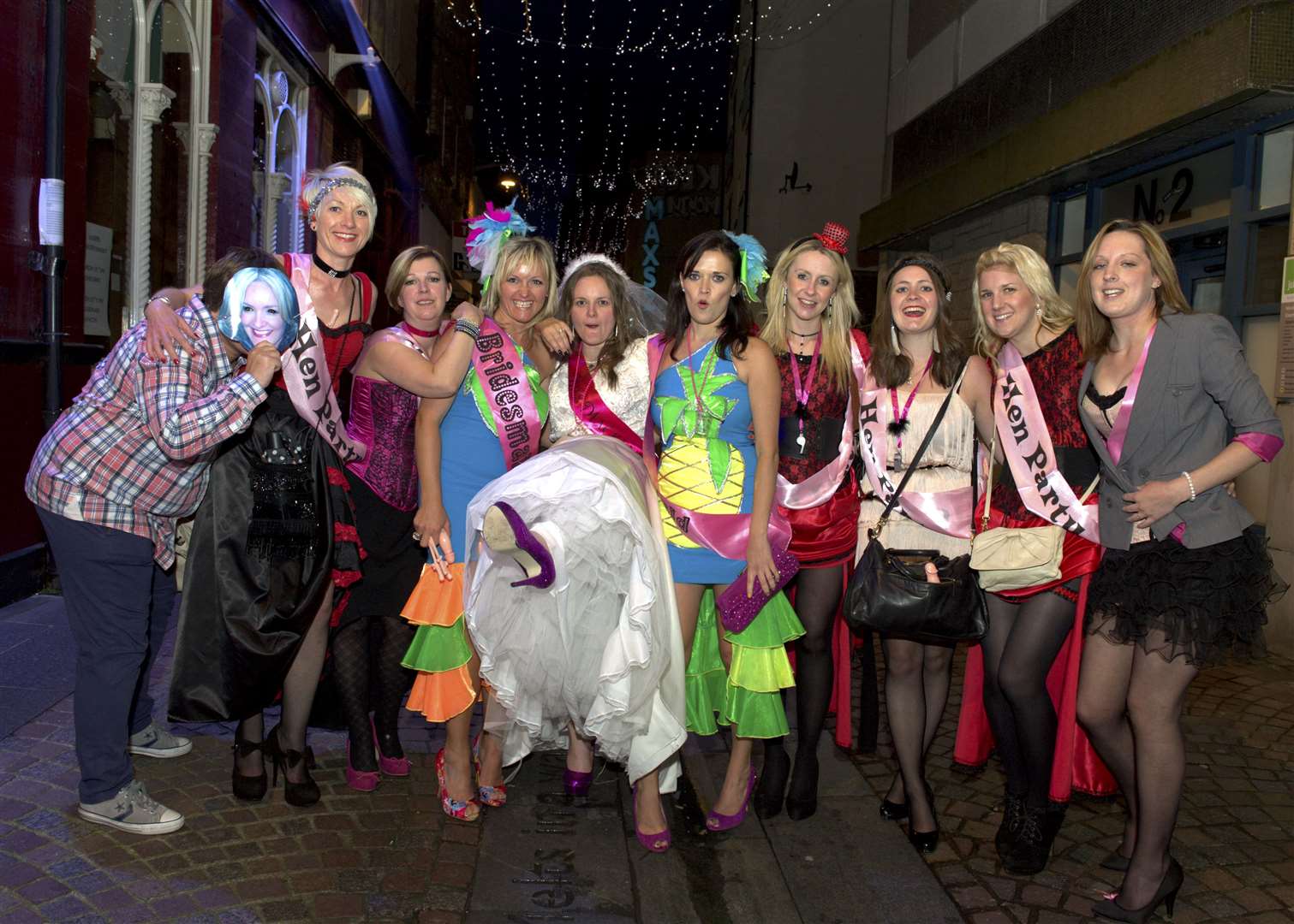 On her hen night with her hens is Marie Grant (centre, white dress). Picture: Callum Mackay. Image No. 019214.