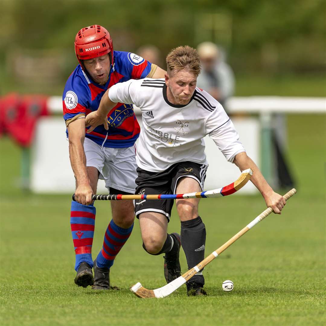 Lovat’s Lorne Mackay gets in front of James Hutchison (Kingussie). Kingussie v Lovat in the Artemis MacAulay Cup semi final (north), played at Braeview Park, Beauly.