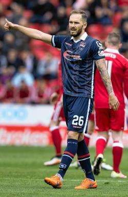 Ross County’s Martin Woods celebrates after scoring his side’s fourth goal at Aberdeen on Sunday.