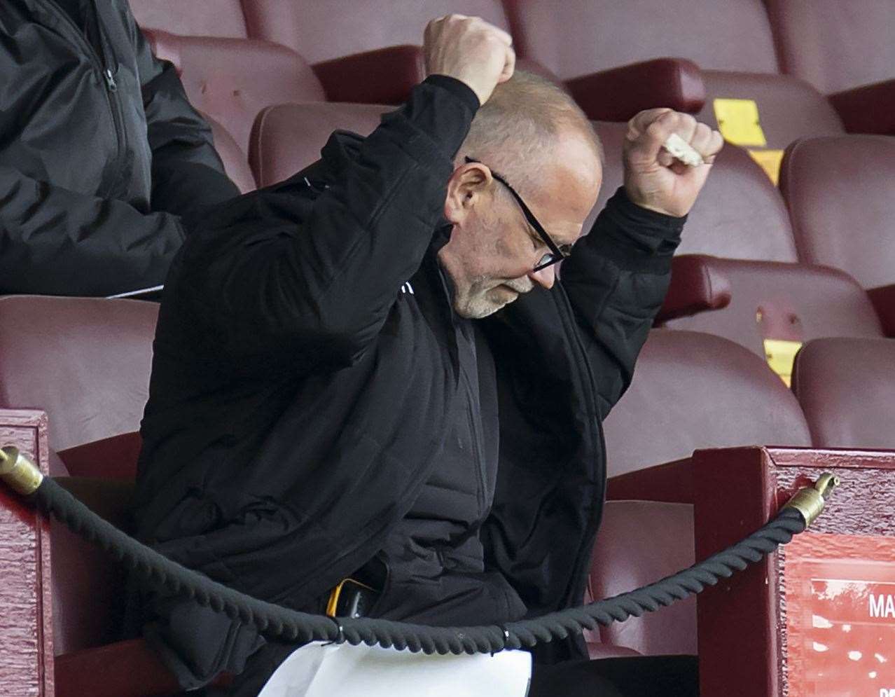 Ross County manager John Hughes celebrates after watching his team beat Motherwell yesterday.