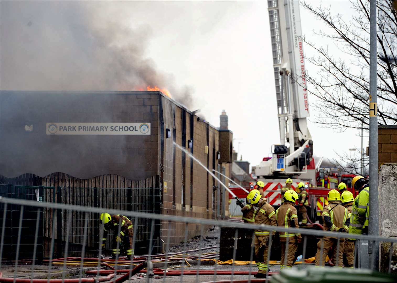 Firefighters dousing flames at Park Primary School. Picture: James MacKenzie.