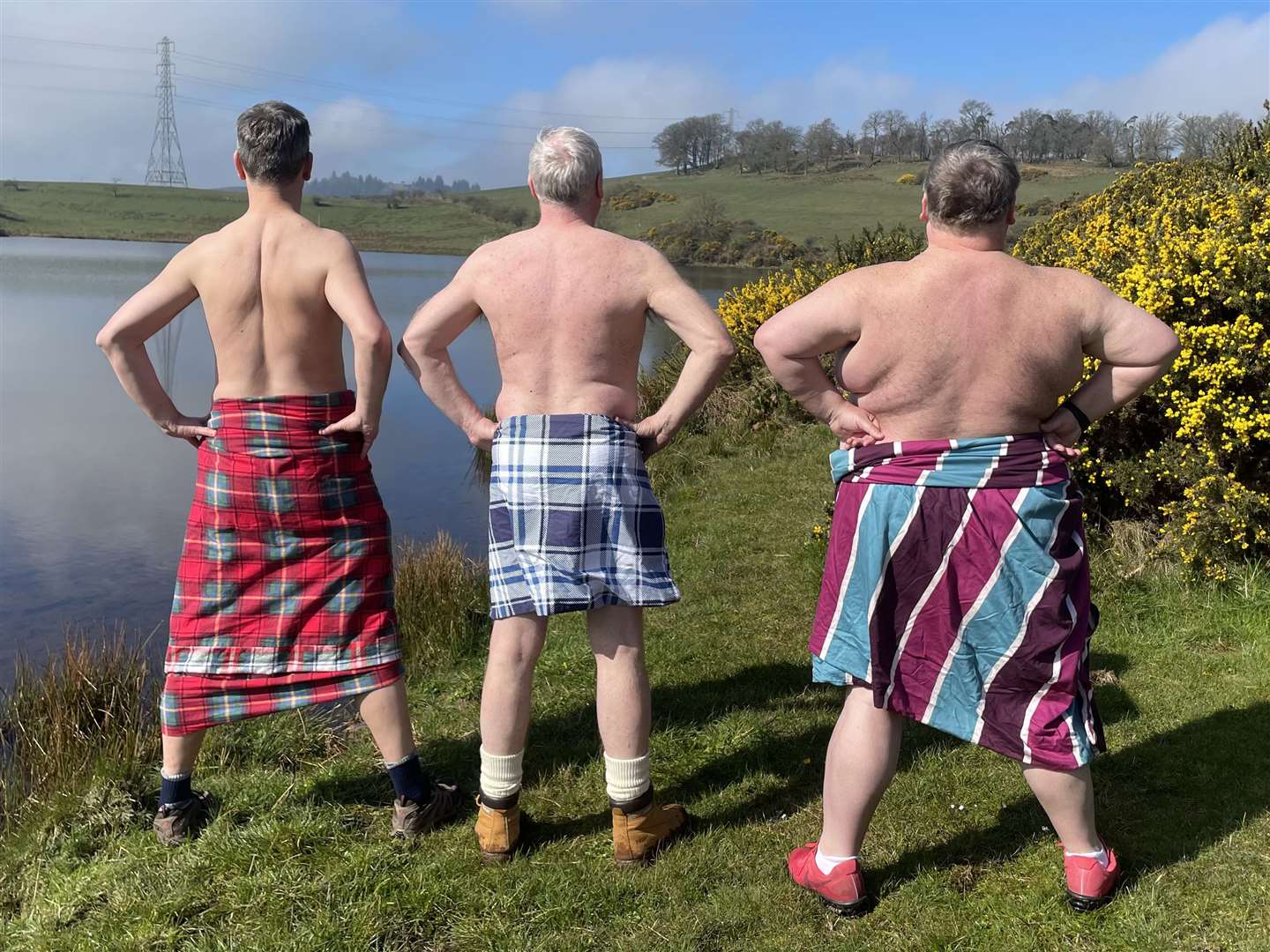 The Men in Quilts, Ronnie Black (right), Kenny Sinclair (middle) and Graham Stewart (left) take in the scenery (Ewan Pringle/PA)
