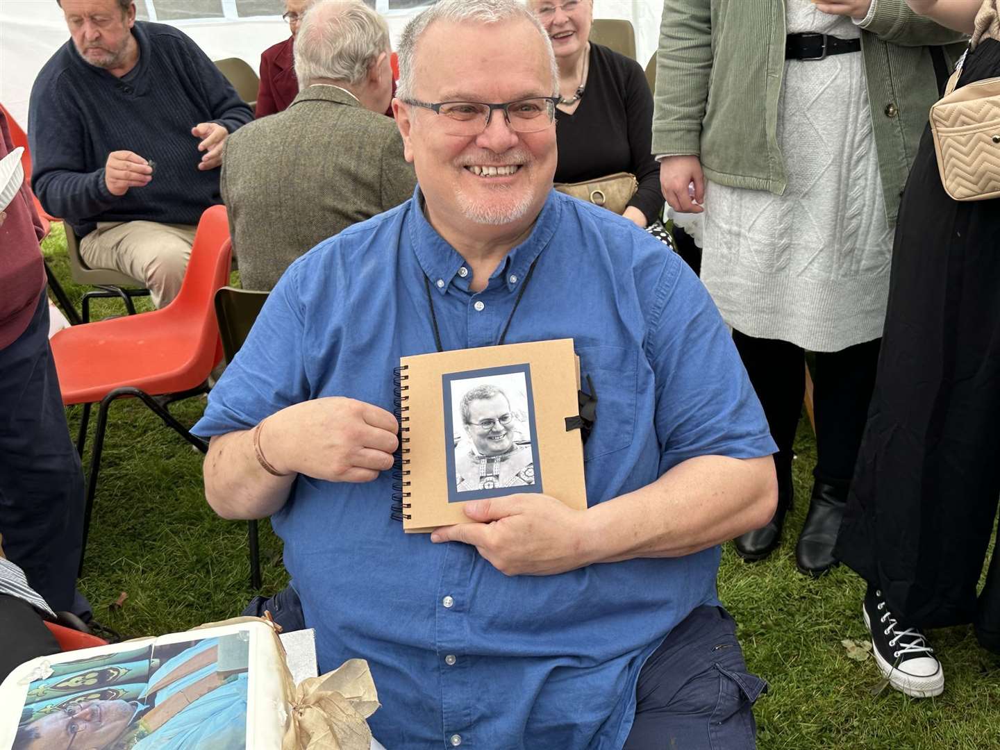 Father Mel was delighted with a book of messages presented to him after the service in Fortrose.