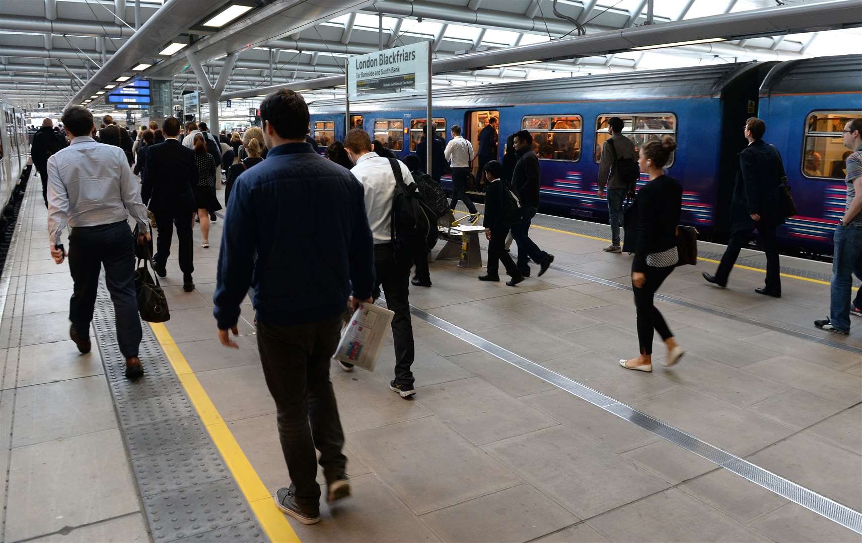 Commuters make their way across a platform at Blackfriars Station, London (Andrew Matthews/PA)