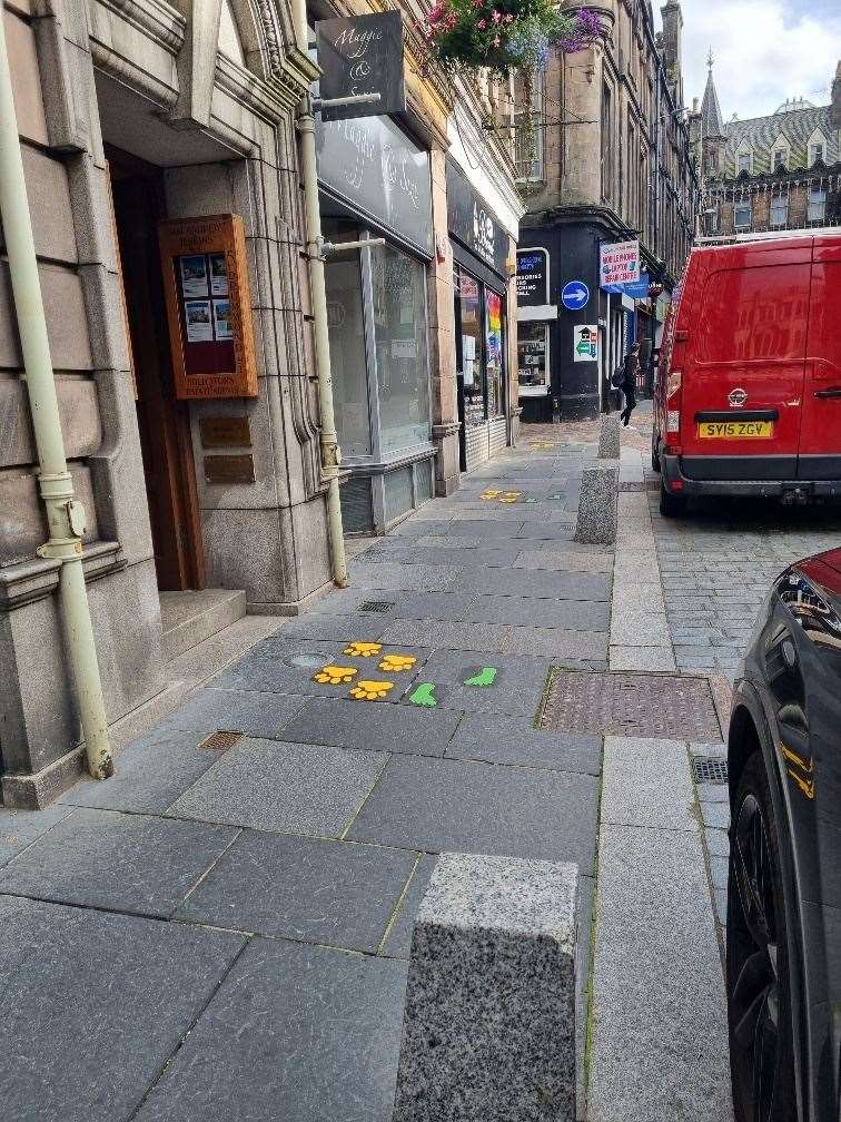Colourful footprints have appeared in the city centre.