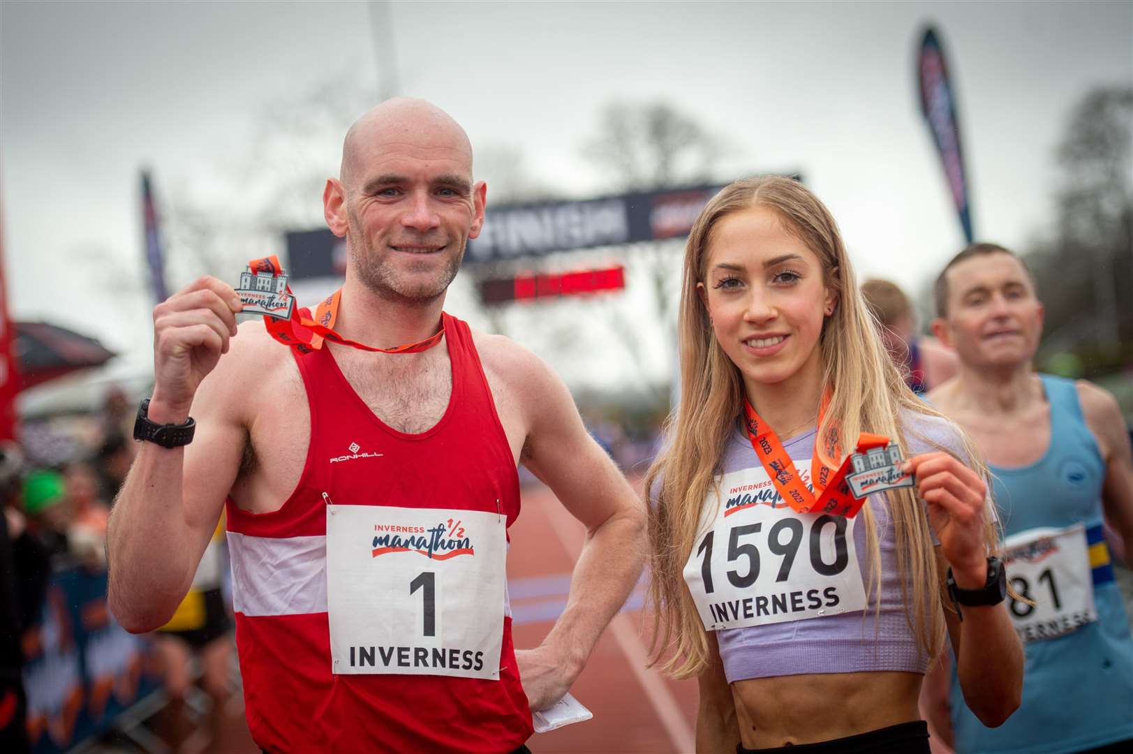 Inverness Half Marathon 2023 men's winner Fraser Stewart and women's winner Natasha Phillips with their medals – but runners this year will have to wait. Picture: Callum Mackay