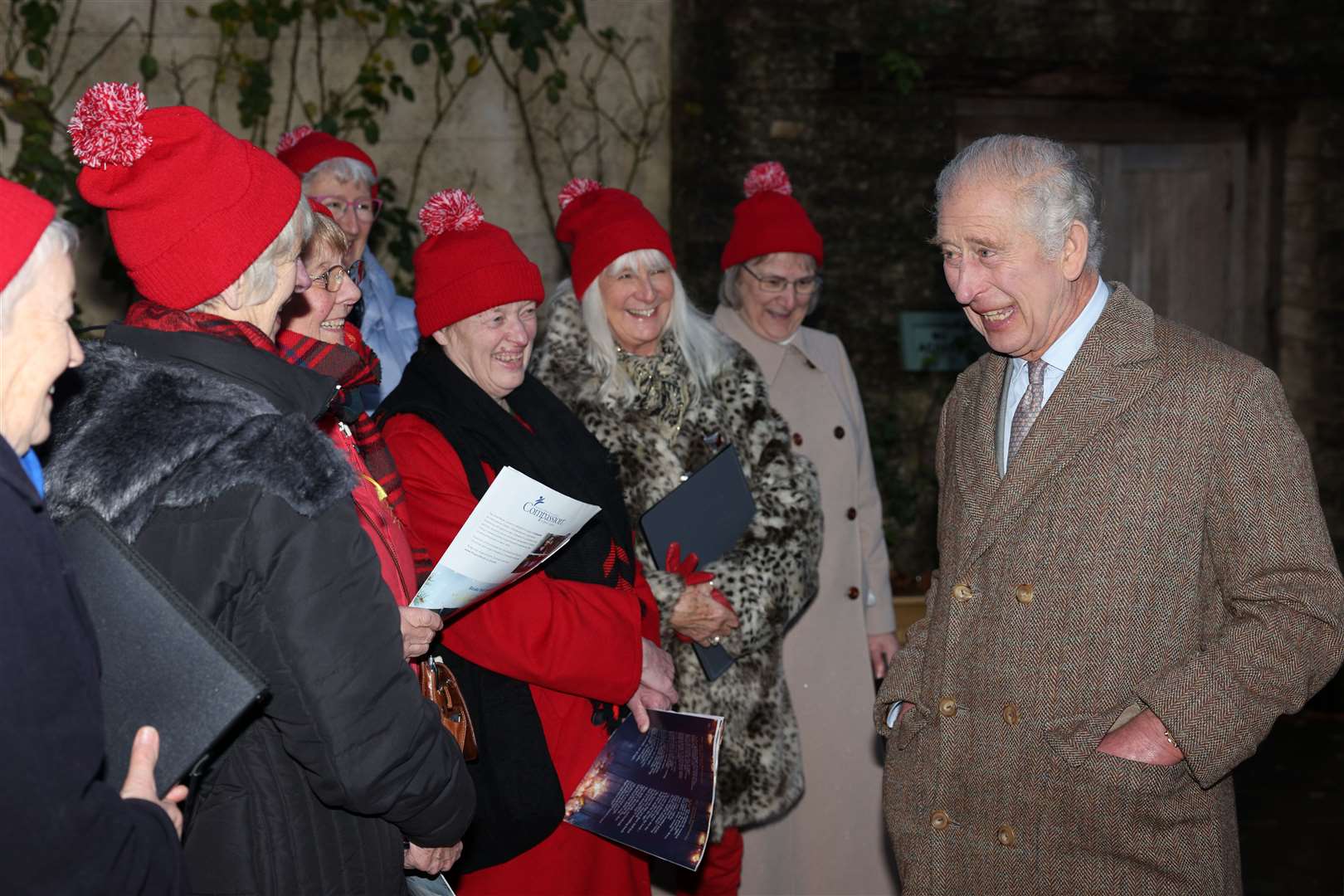 The King meets carol singers during a Celebration of Craft reception (Adrian Dennis/PA)