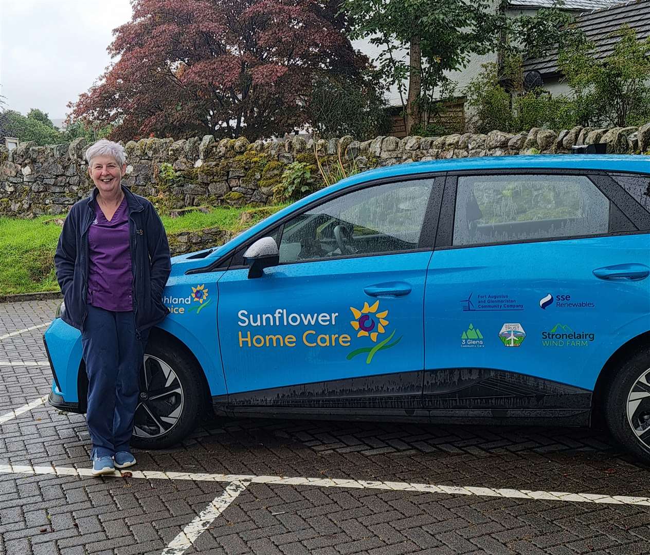 A 3 Glens home carer with one of the electric vehicles they now have access to.