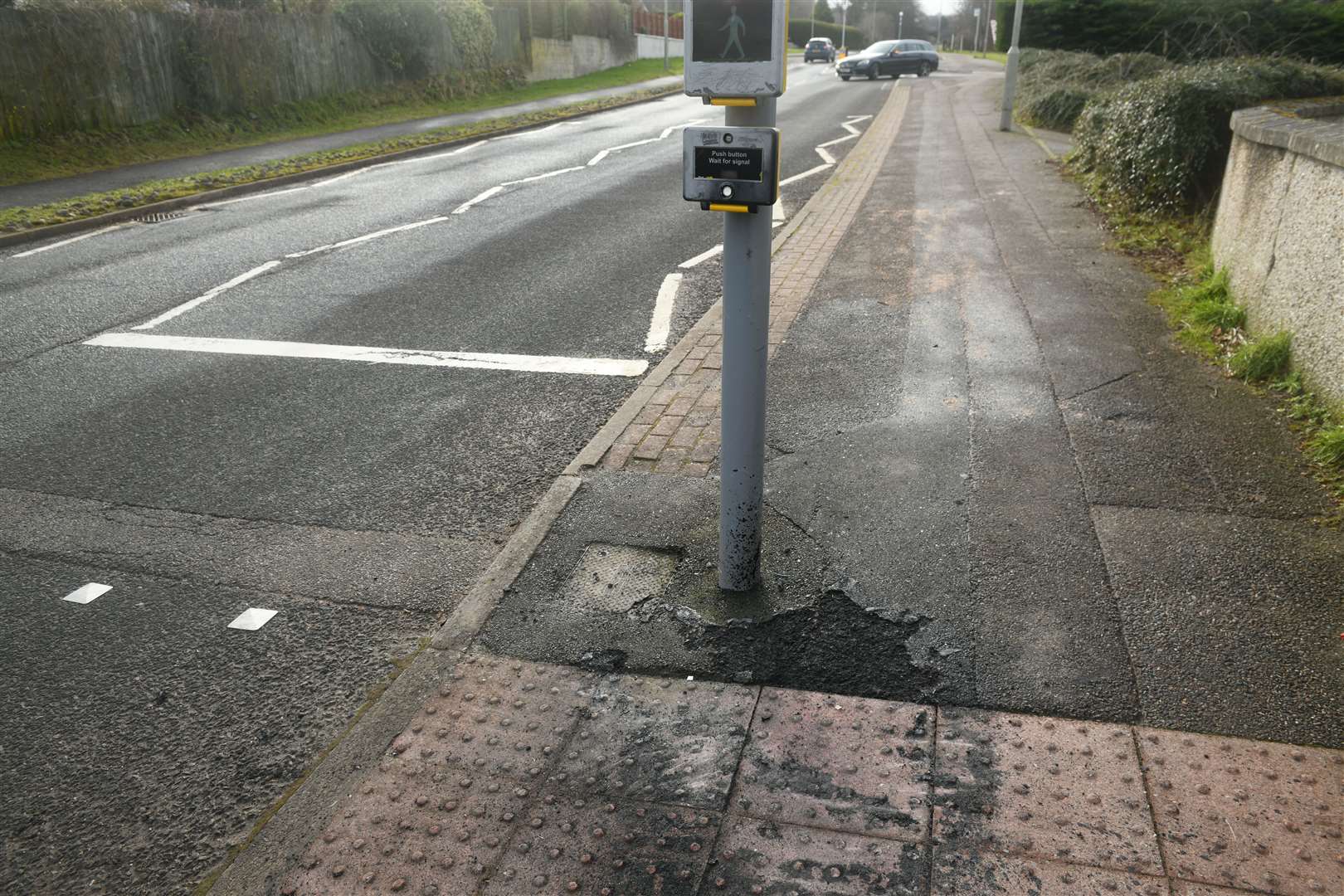 Some of the residue from the melted traffic light fascia can be seen on the ground. Picture: James Mackenzie.