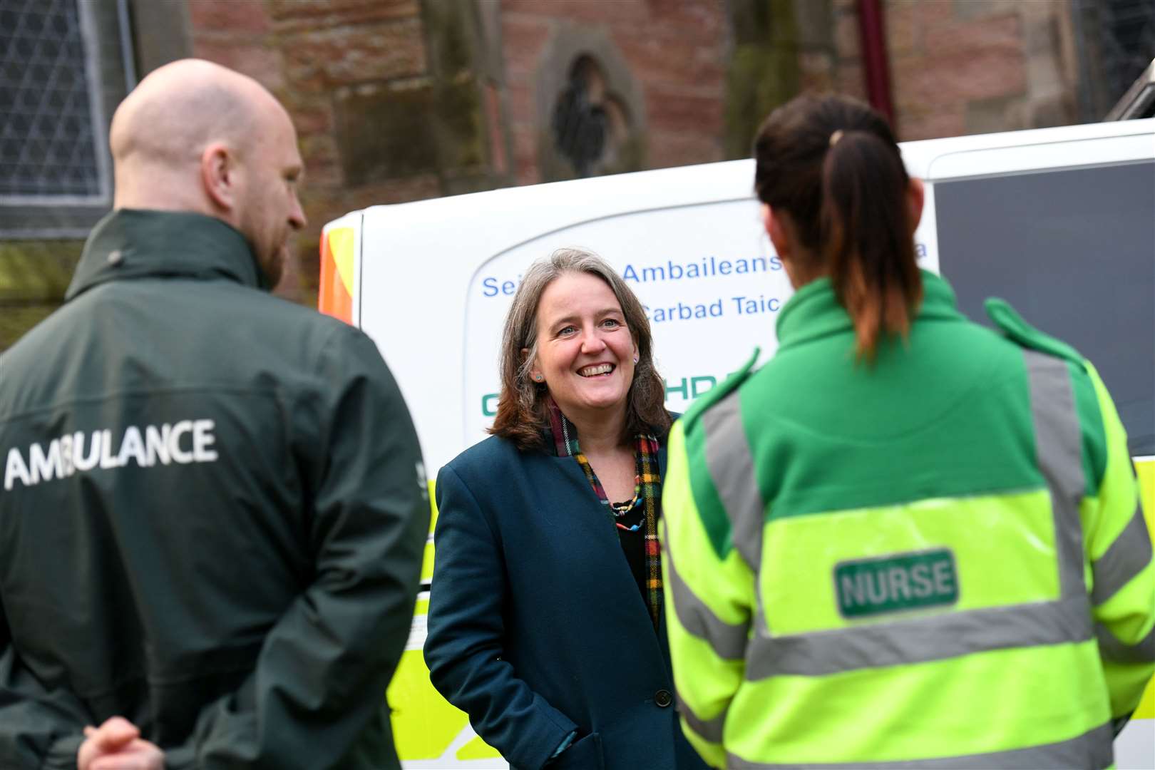 Maree Todd with ambulance staff at the launch of the new service. Picture: Callum Mackay