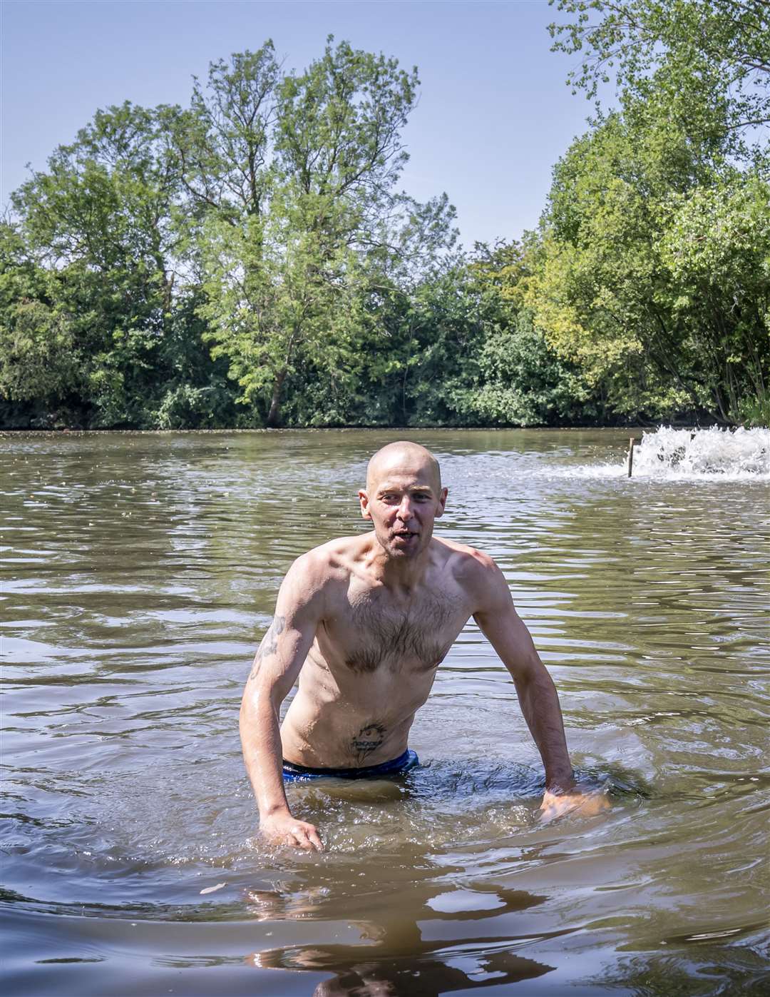 A man swims in a lake in Sandall Park, Doncaster (Danny Lawson/PA)